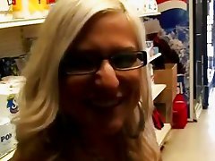 Blonde milf giving a blowjob in public