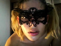 Masked blonde tranny plays with sex toys on the webcam