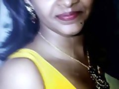 cumming on Saranya Nag yellow blouse and face