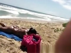 Busty woman sunbathing in bikini