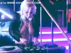 Busty DJ plays stylish music with nude tits