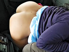 Blowjob in the car in public by a busty Thai MILF who enjoys sucking a big cock