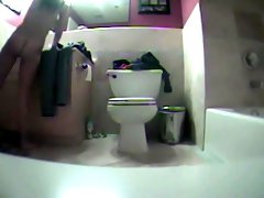 Naked girl finishing her bathroom routine