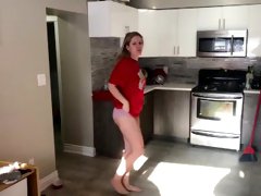Young and cute blond girl pees on toilet