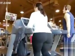 Fat ass woman walks on the treadmill