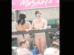 Undressed girl with small tits on a parade float