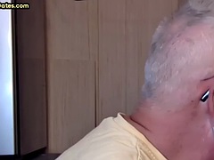 Gray-haired dilfa at the glory hole sucks cock in a private close-up video