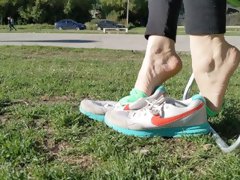 Shoeplay with sneakers at the park -- Preparing smelly socks for shipping